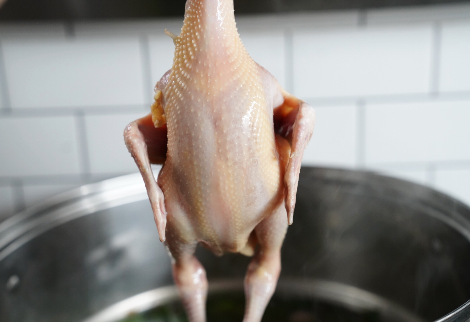 Boil chicken briefly then remove from pot.