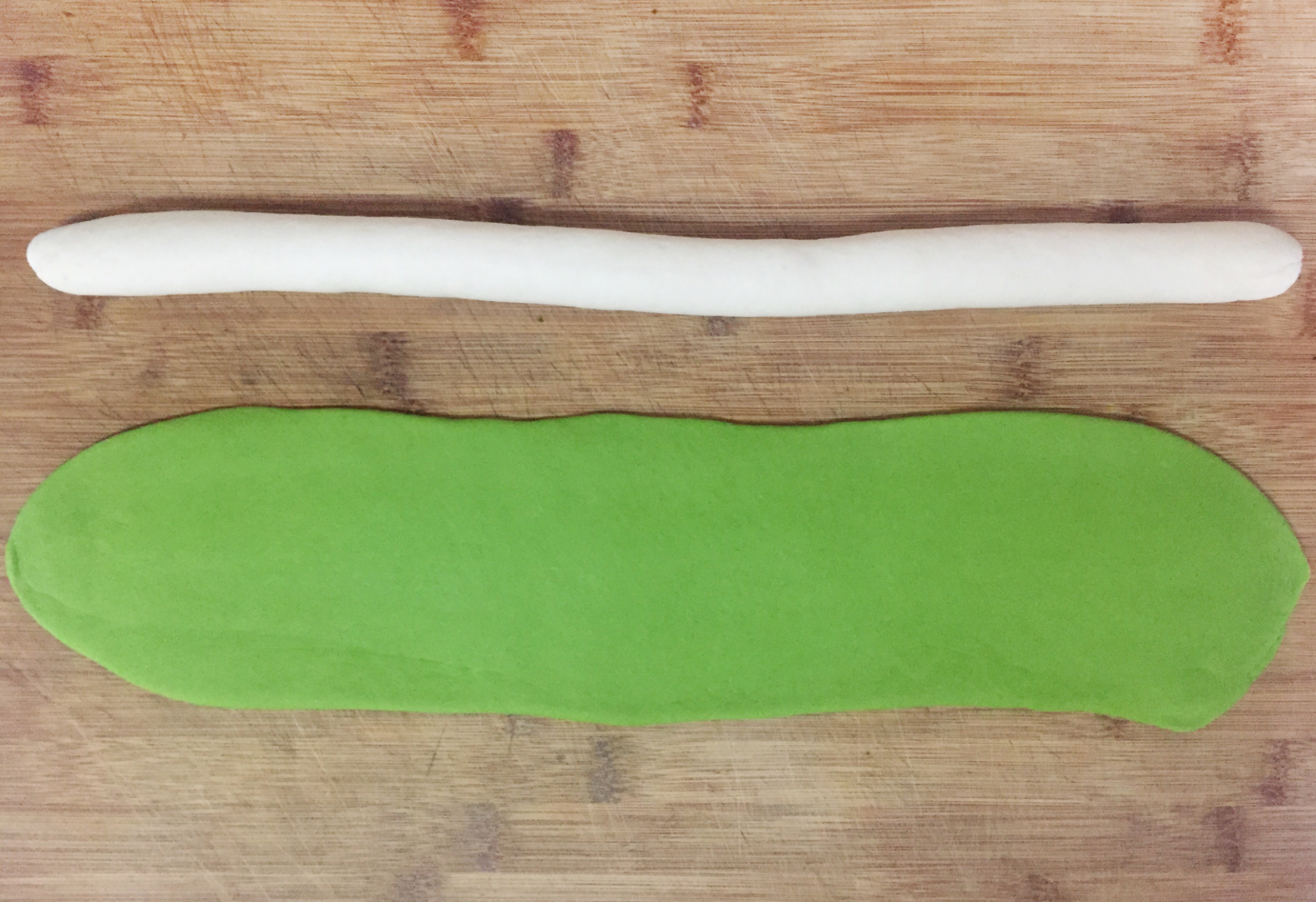 Roll white dough into strips, roll green dough into rectangle after resting.