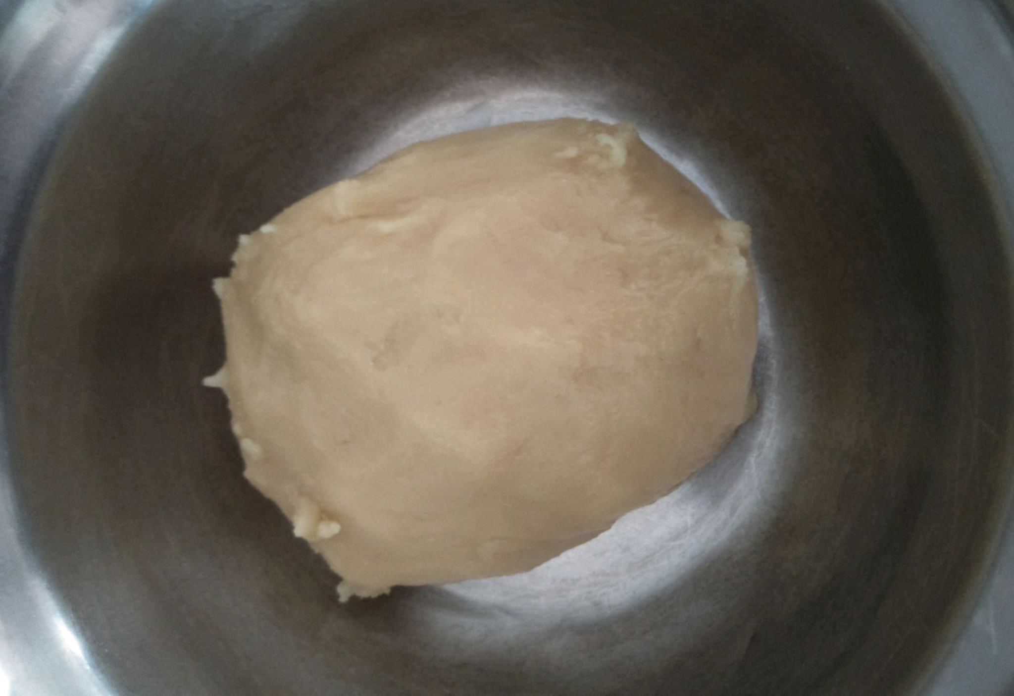 Knead dough until smooth, wrap in plastic, rest for an hour. Avoid over-kneading.