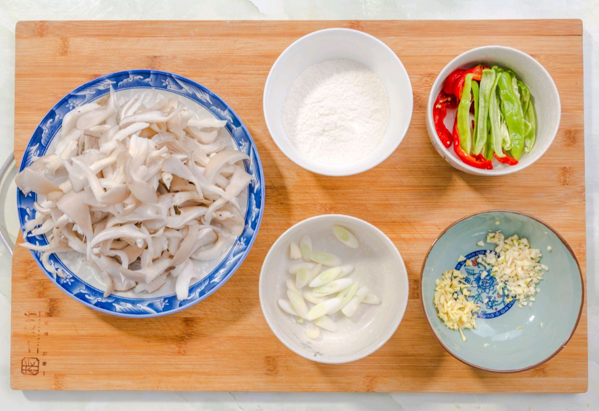 Prepare ingredients for a stir-fry: bell peppers, scallions, ginger, garlic.