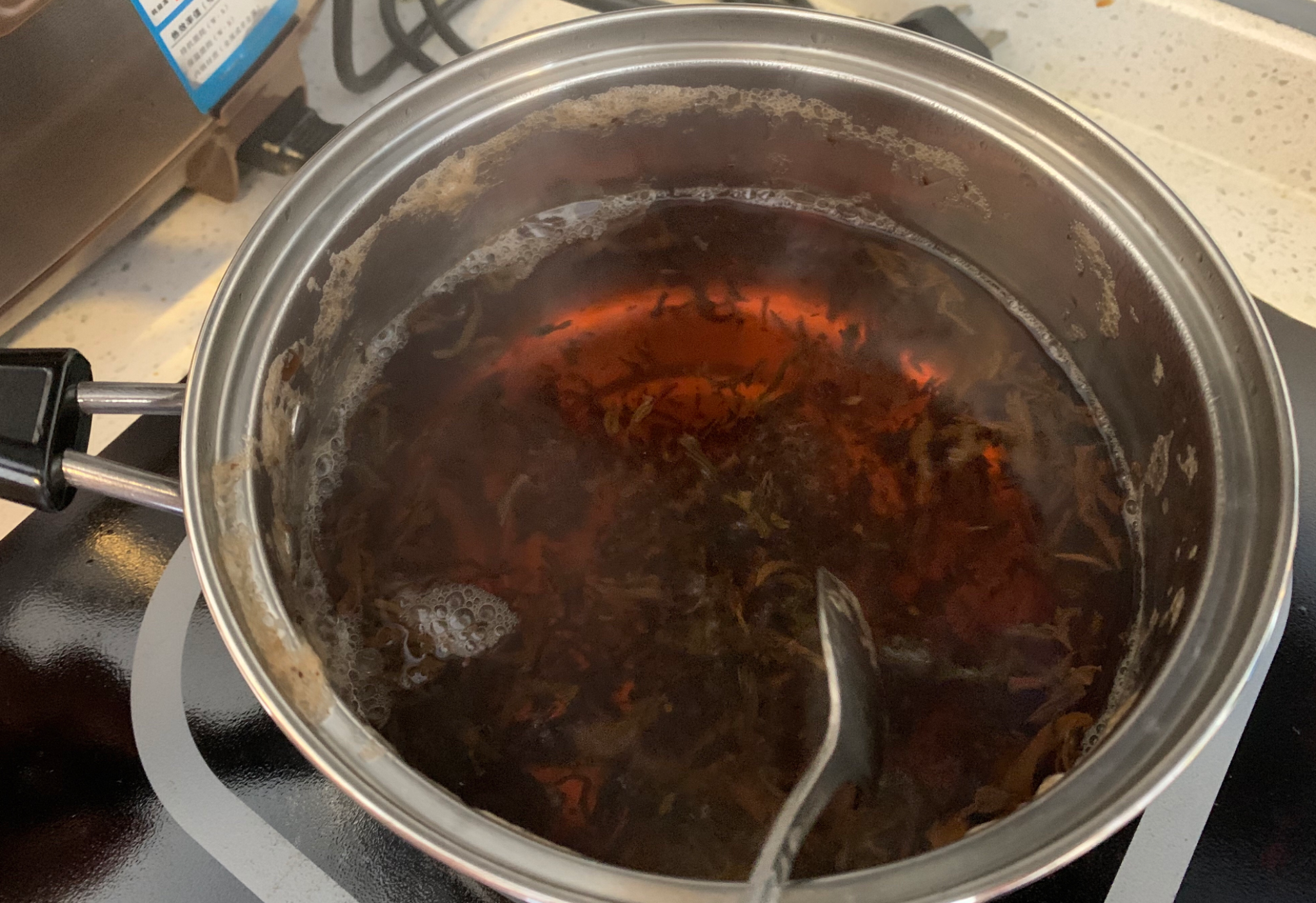 Boil water, add black tea leaves, simmer for 3 minutes.