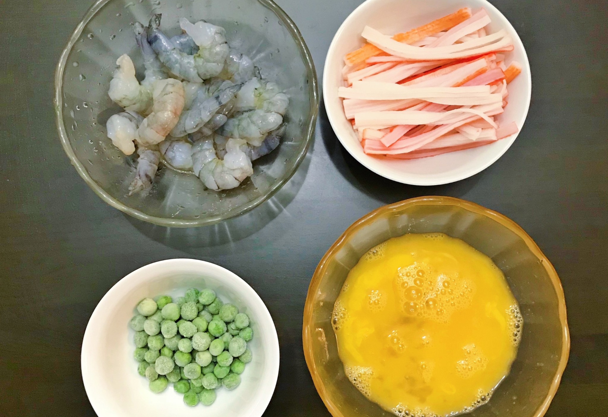 Marinate shrimp and crab sticks, prepare seasoned eggs for tasty dish.