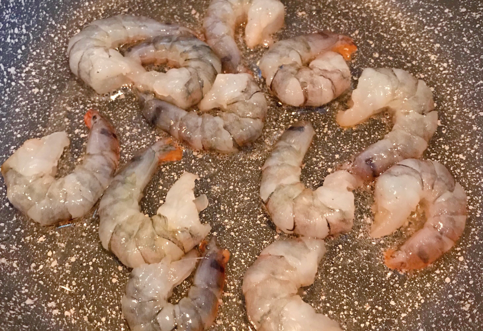 Stir-fry shrimp in hot oil for 20 seconds to seal in moisture and maintain tenderness.