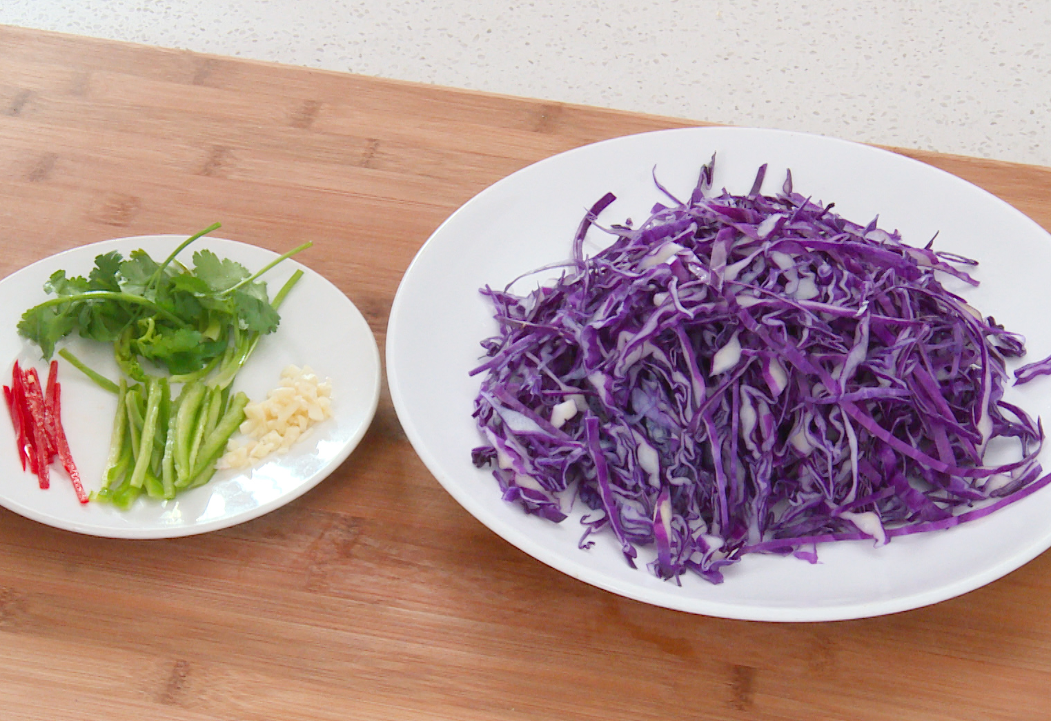 Prepare vegetables: shred cabbage, slice bell peppers, crush garlic, chop cilantro.