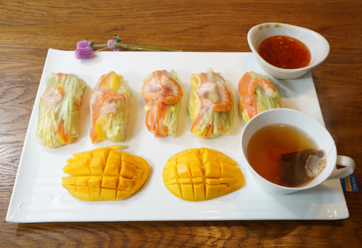 Plate spring rolls with sweet chili sauce; steep mint tea for a refreshing breakfast.