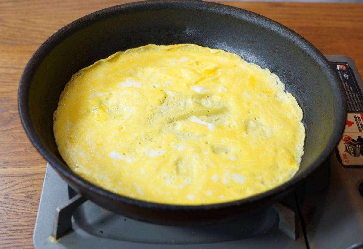 Heat oil, pour egg mixture in skillet, spread to make thin crepe.