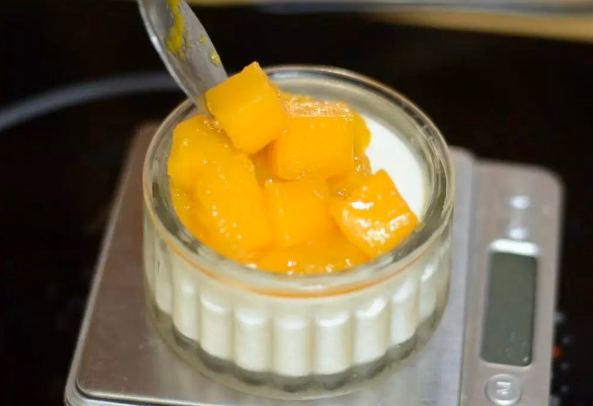 Suggest topping dish with fresh mango cubes.