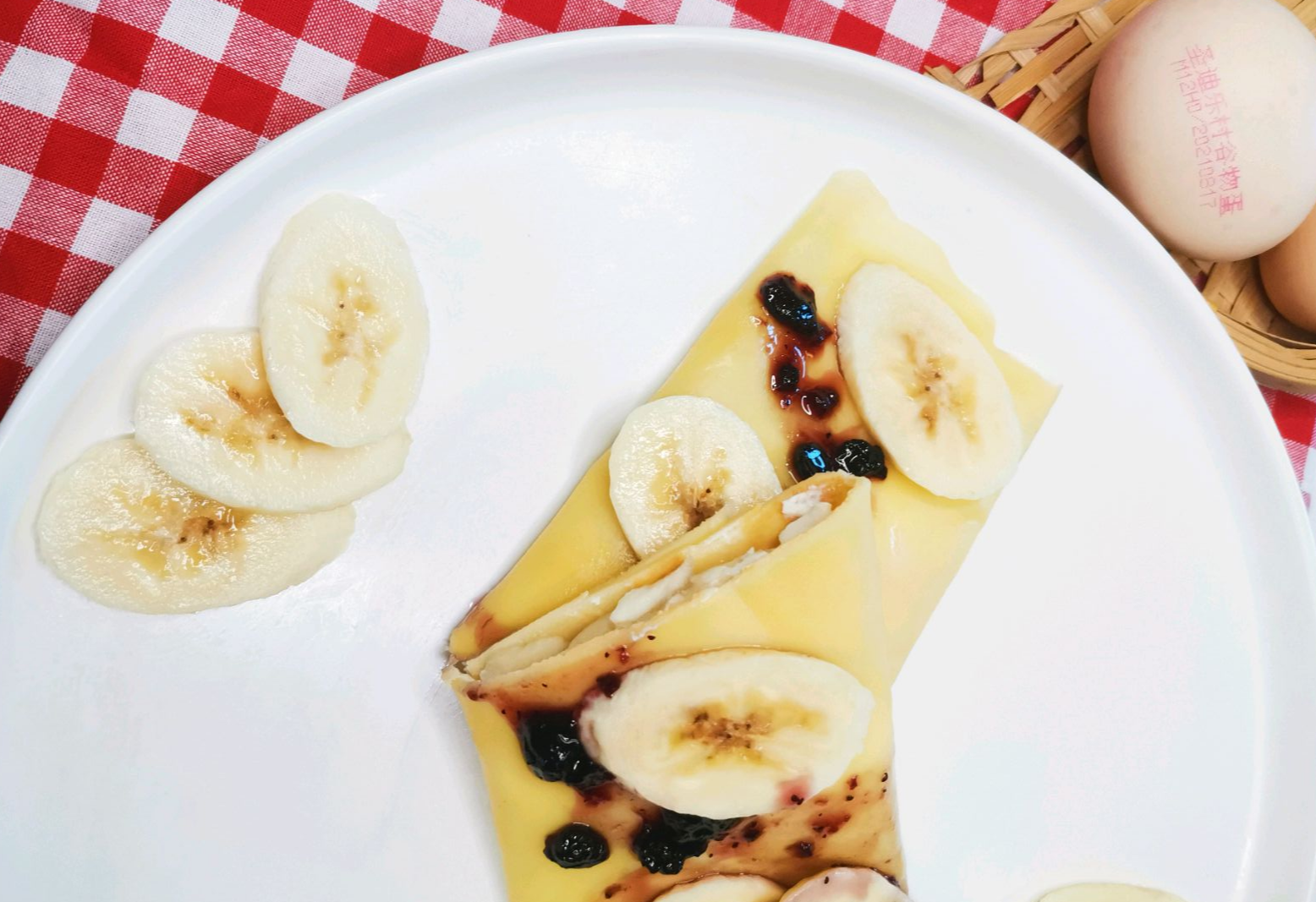 Make a banana crepe topped with blueberry jam for a tasty treat!