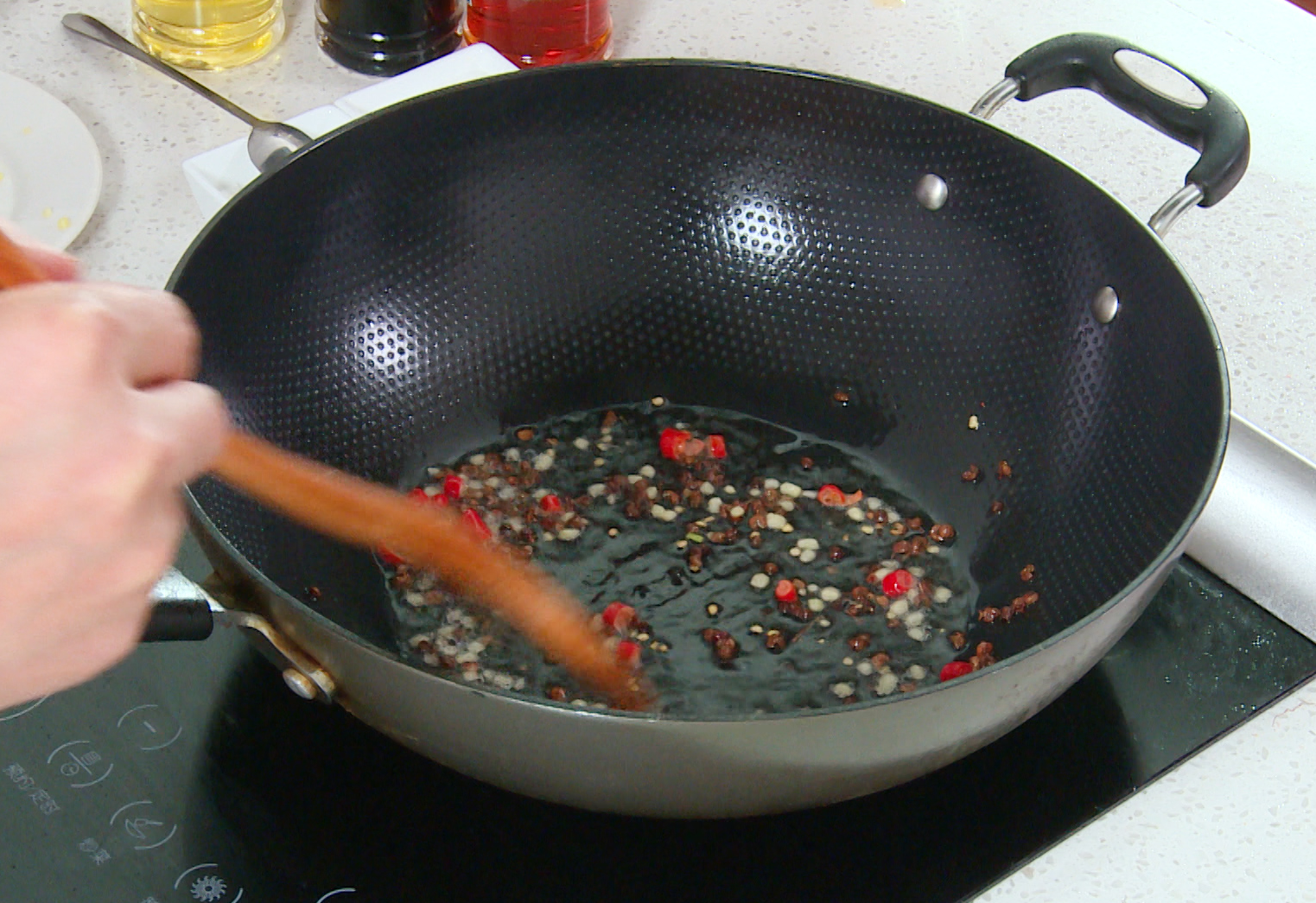 Make Sichuan Pepper Oil: Heat oil in a pan, add peppercorns, ginger, chili, and cook until fragrant.