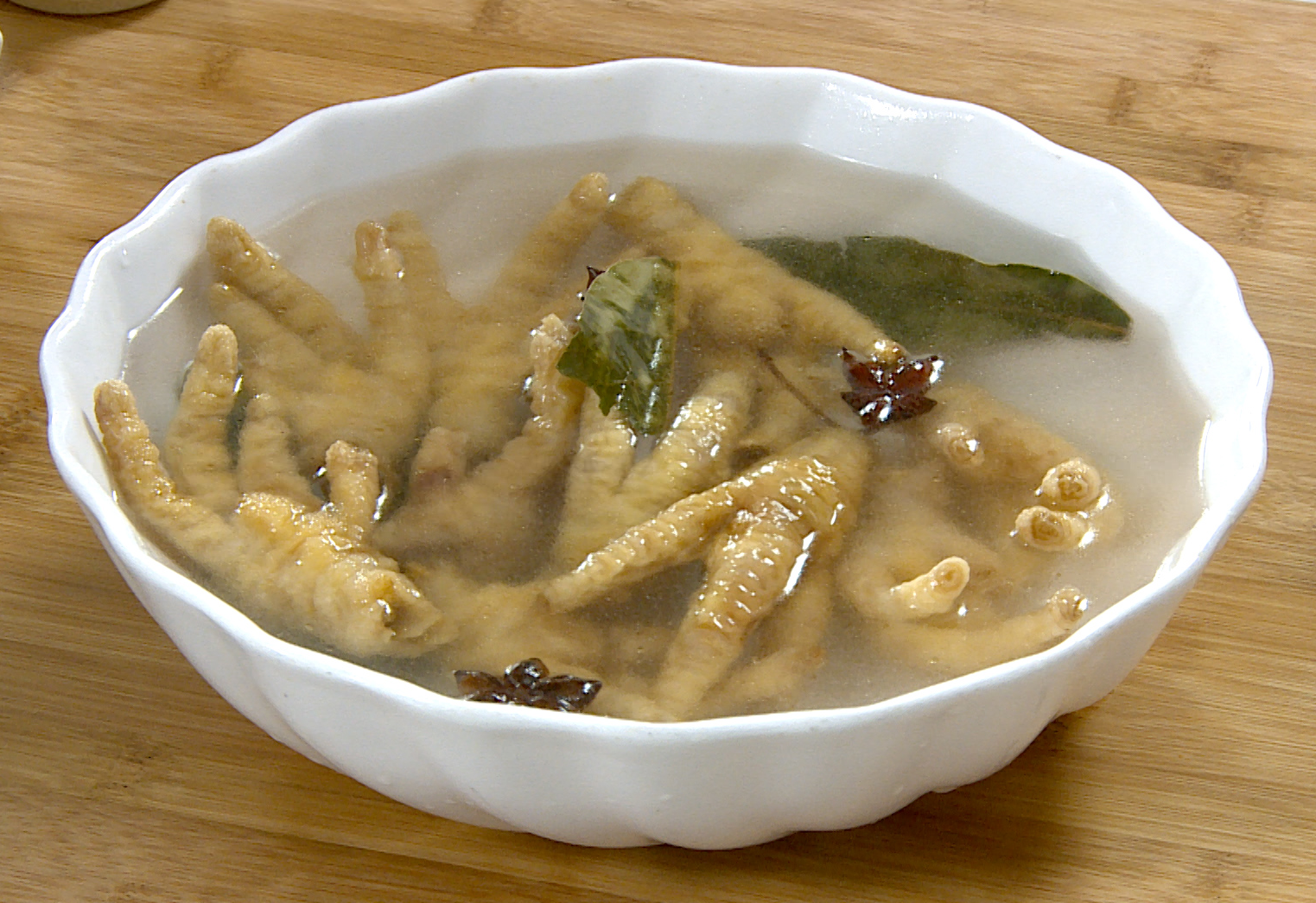 Soak chicken feet with Sichuan peppercorns, white pepper, and sugar for 4 hours.