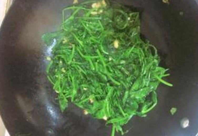 Season almost cooked pea shoots with salt to taste.