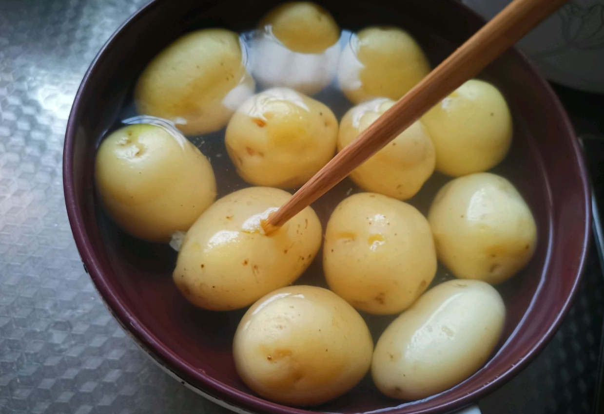 Cook potatoes to 70%, test with chopstick for doneness.