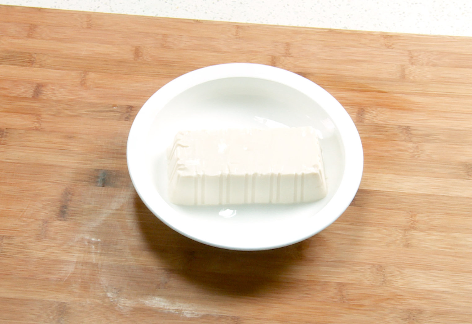 Instructions for preparing silken tofu on a plate.