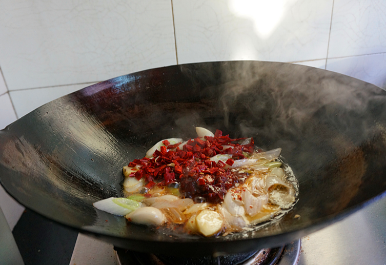 Add dried chili peppers, fermented black beans, and doubanjiang for a spicy kick.