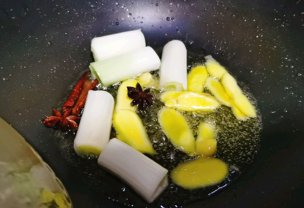 Sauté aromatics in oil for added flavor: ginger, green onion, star anise, and cinnamon.