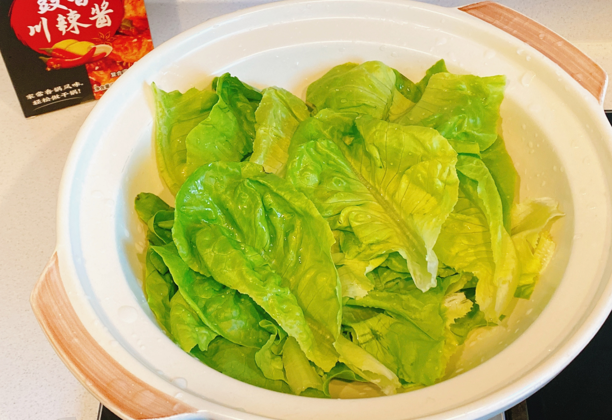 Instructions: Line clay pot with washed lettuce to prepare the base.