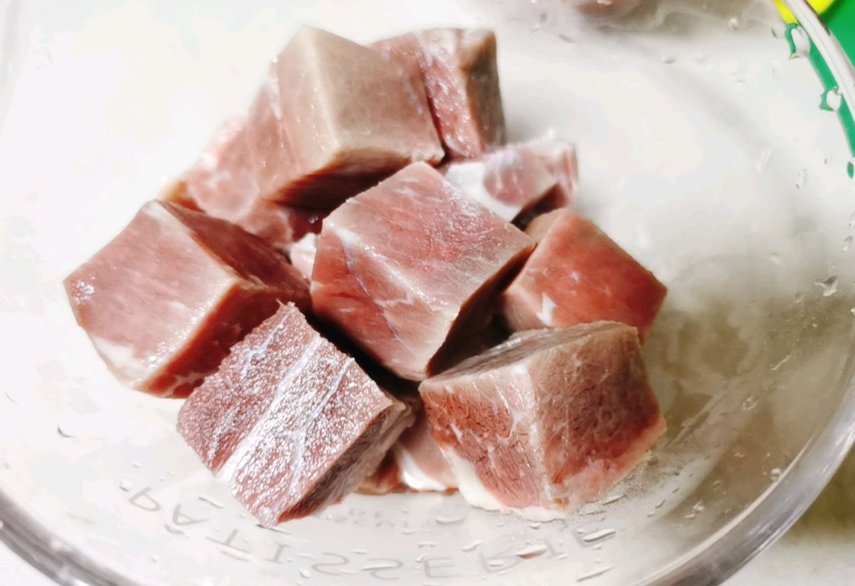 Prepare beef by washing and cutting into chunks before setting aside.