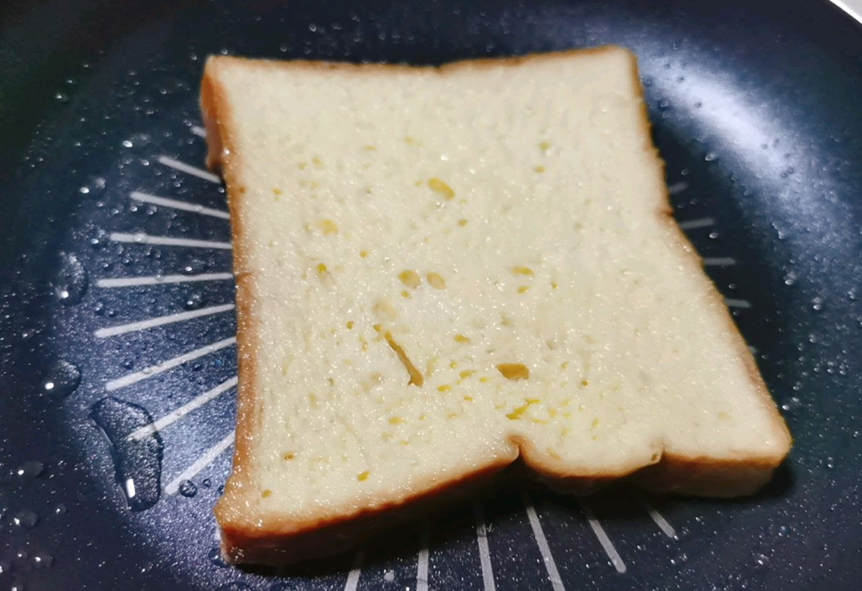 Cook soaked bread in butter on low heat until golden brown on both sides.