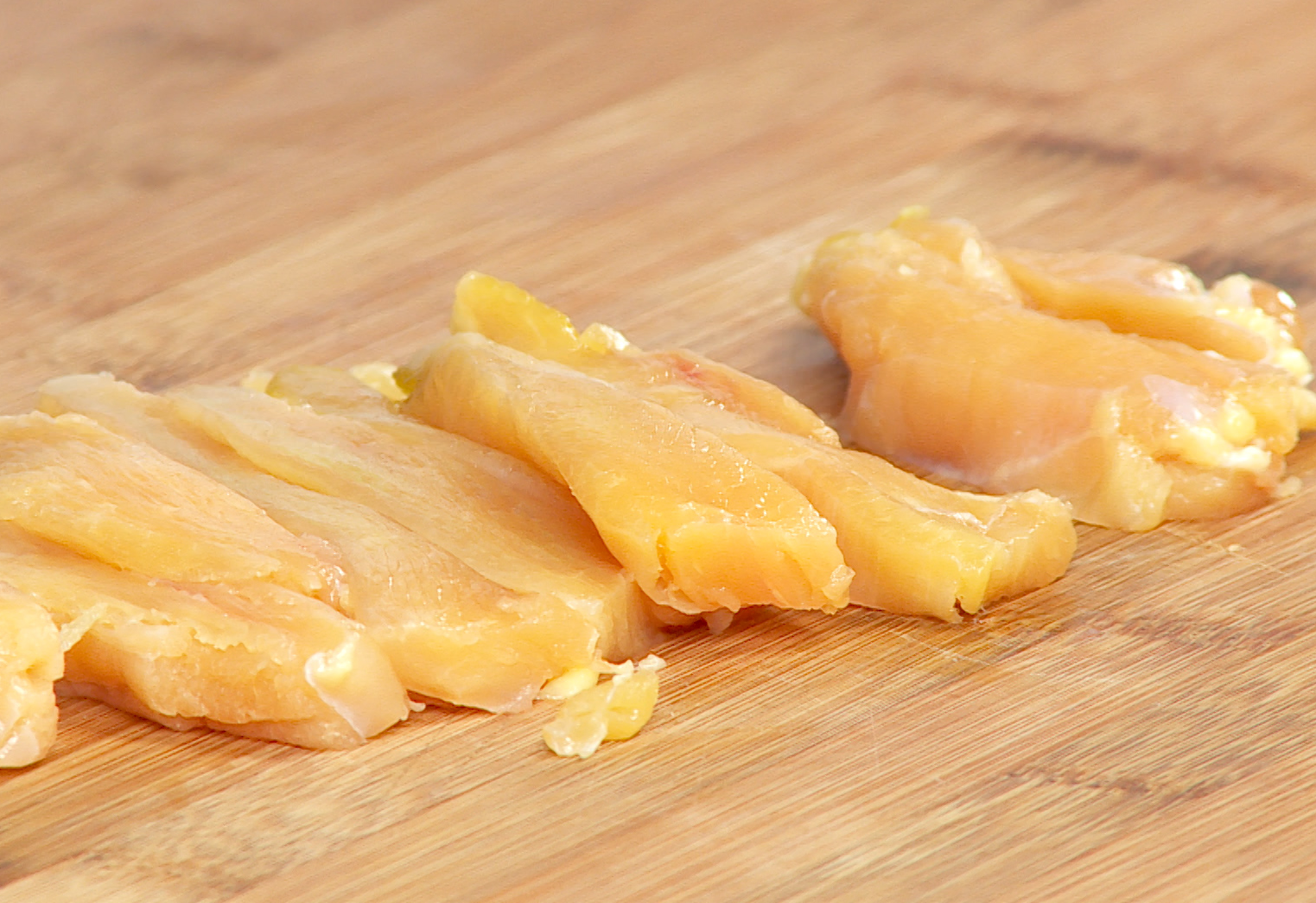 How to prepare chicken breast: tenderize and slice into strips.