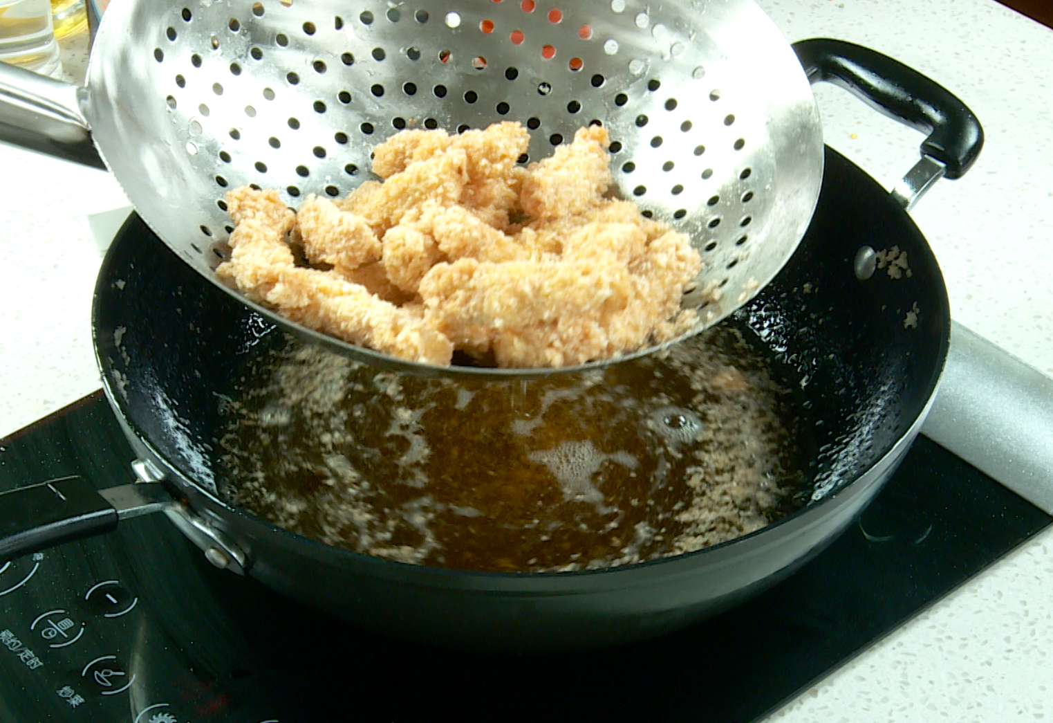 Fry chicken in oil at 350°F for 3-4 mins until golden brown and crispy. Drain on paper towels.