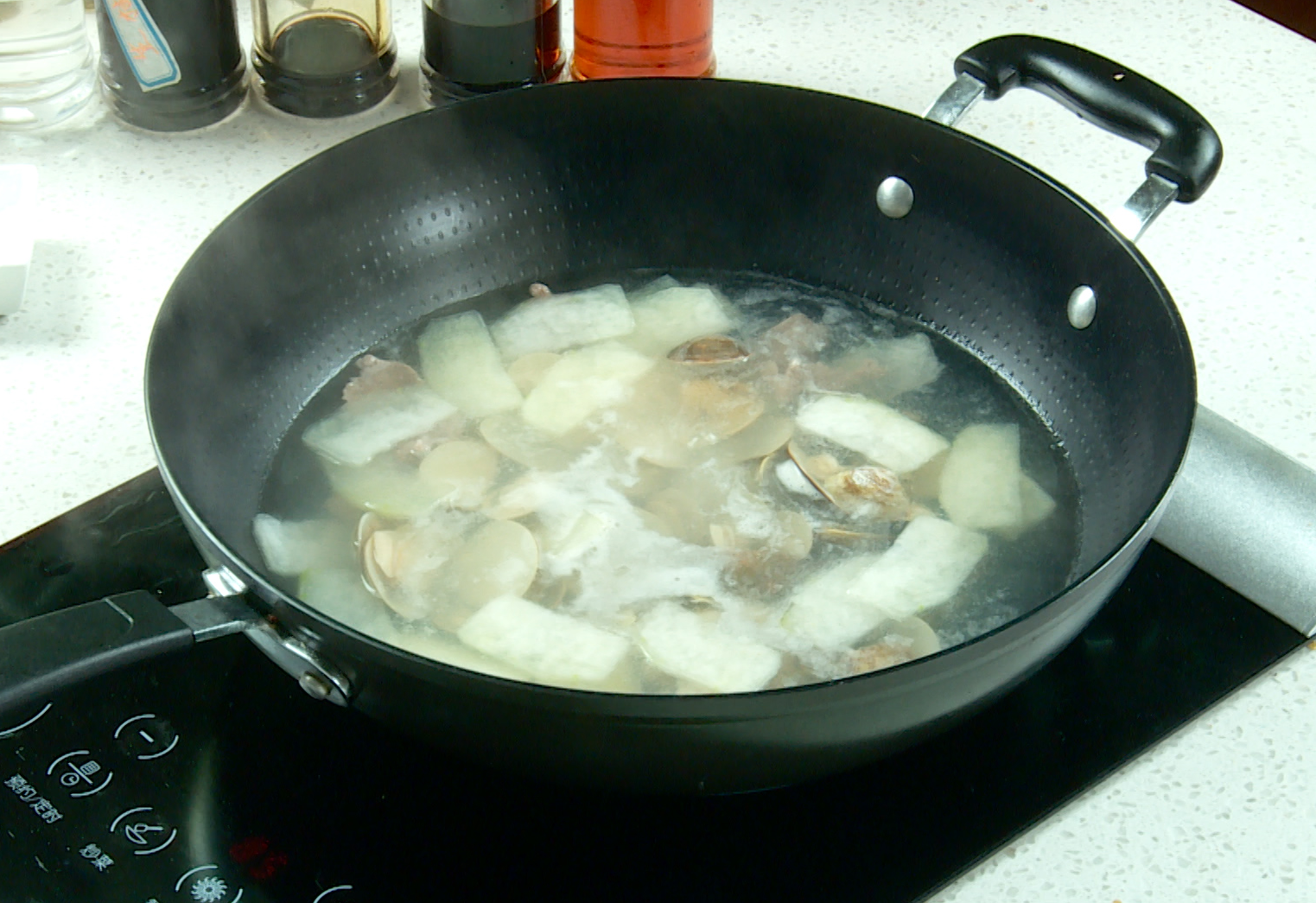 Add steamed clams to soup, cook 2 mins to meld flavors, then season with salt and pepper.