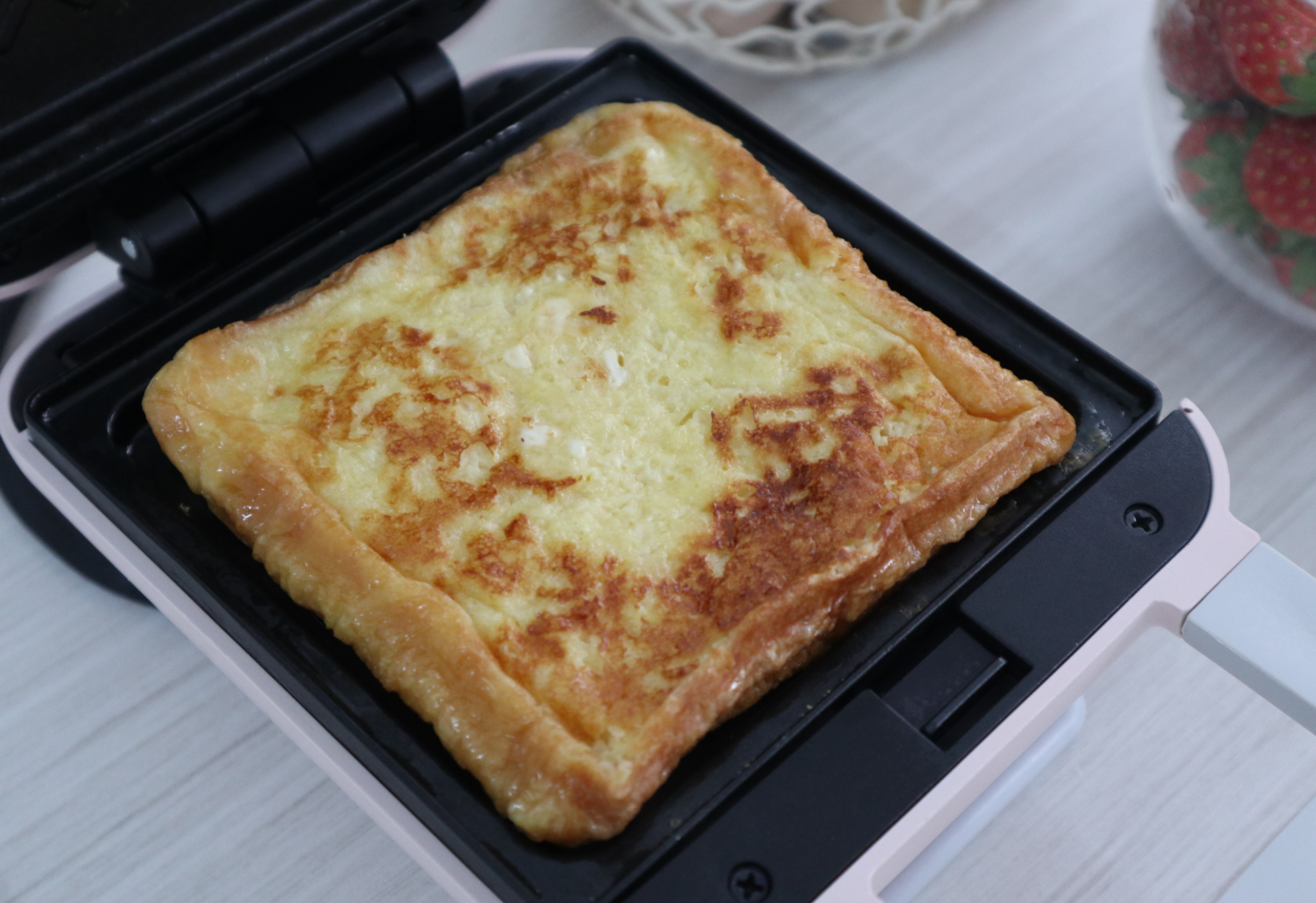 Cook bread with lid open for 4 minutes, then flip.