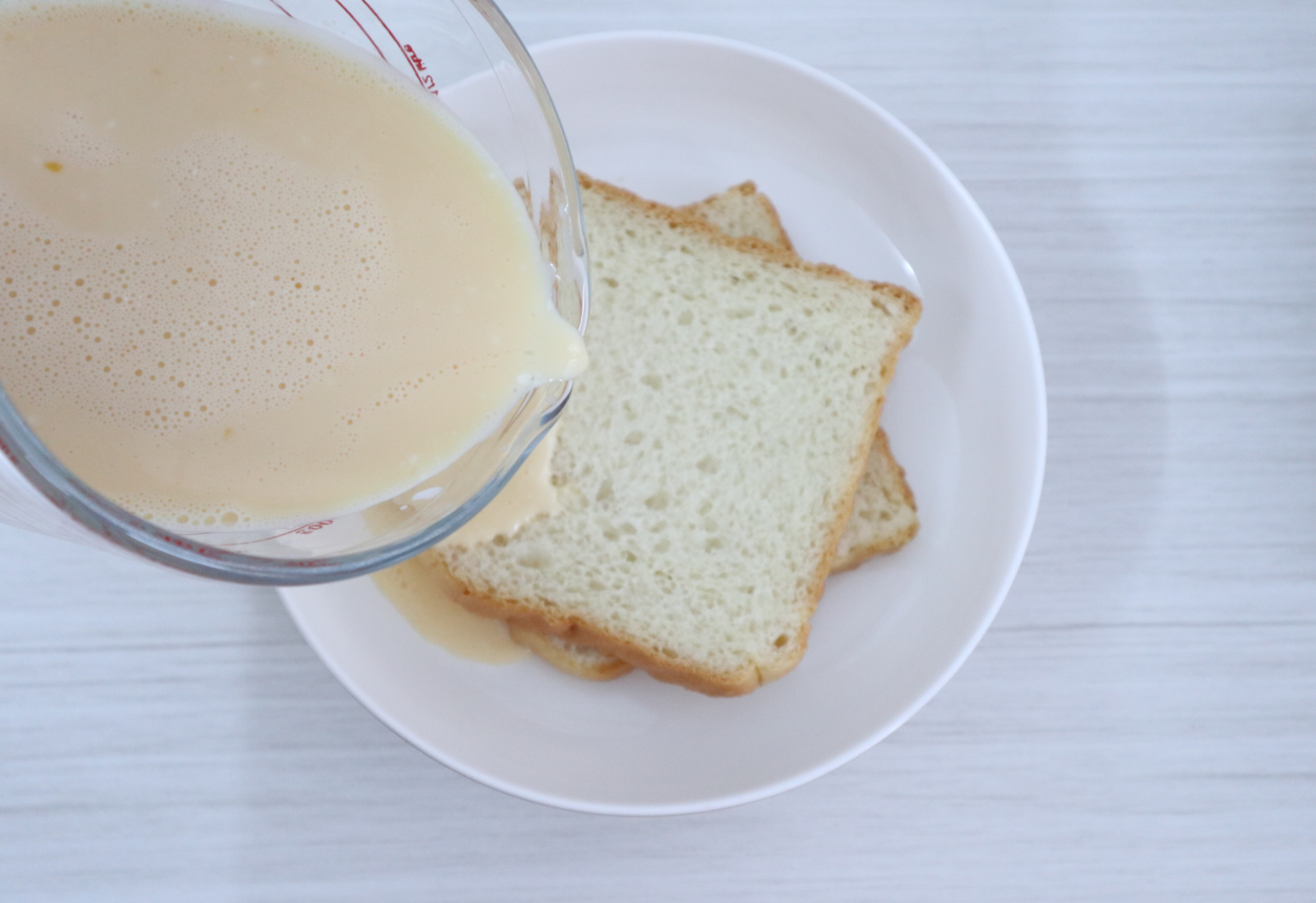 Soak bread slices in egg mixture in a shallow dish.