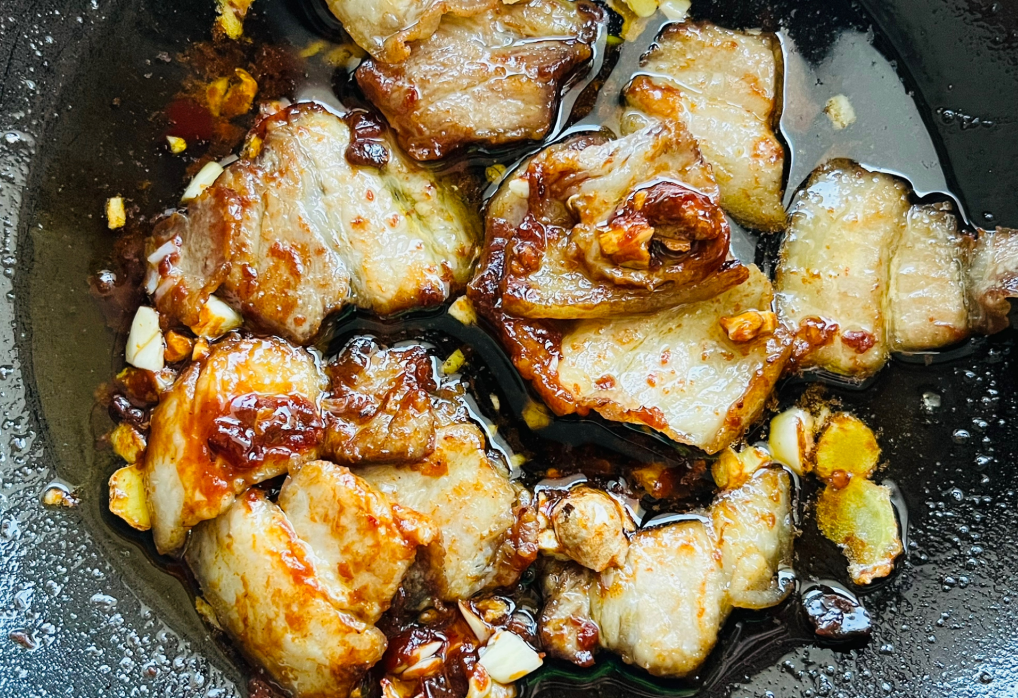 Stir-fry pork belly with ginger, garlic, and Doubanjiang for maximum flavor.