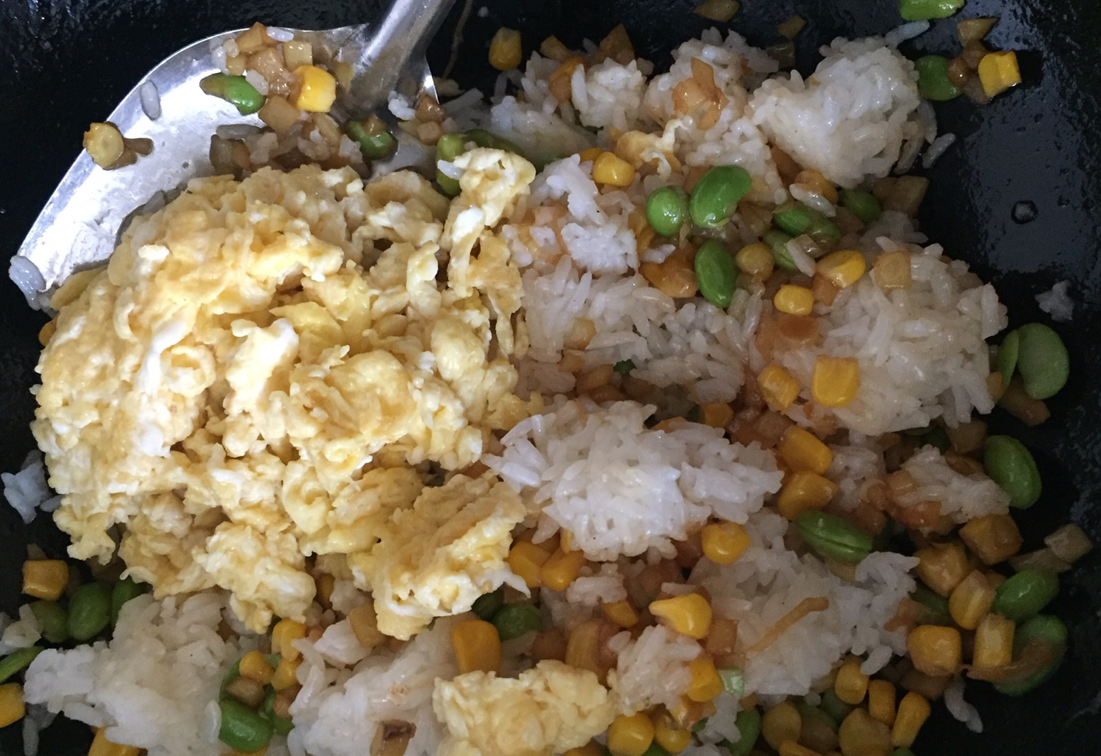 Scrambled eggs combined with rice and seasoned to taste.