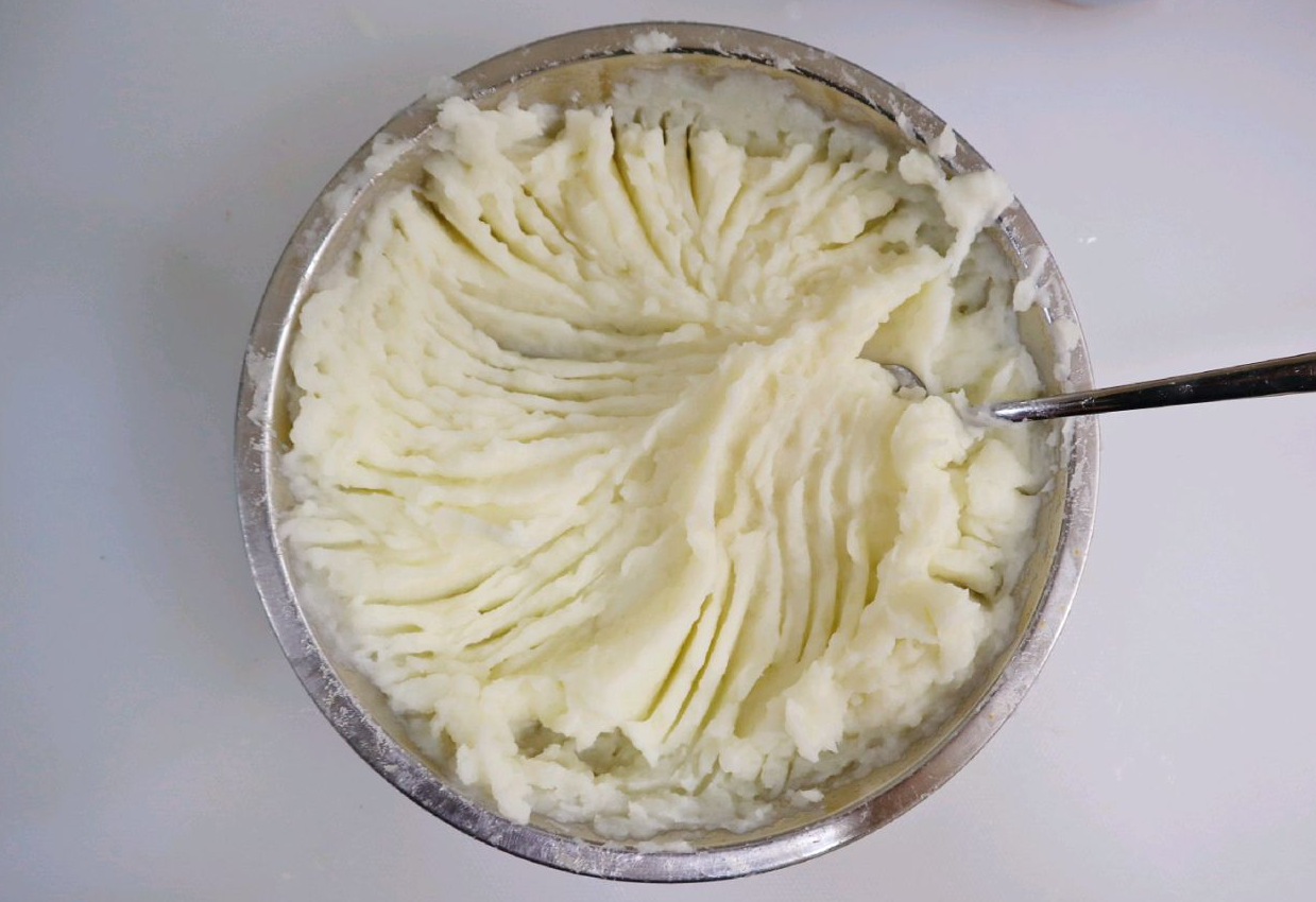 How to mash potatoes: use a fork & add milk gradually for desired consistency.