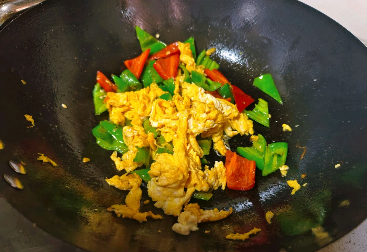 Add eggs back to pan, stir-fry briefly to combine. Avoid overcooking for tender, flavorful eggs.