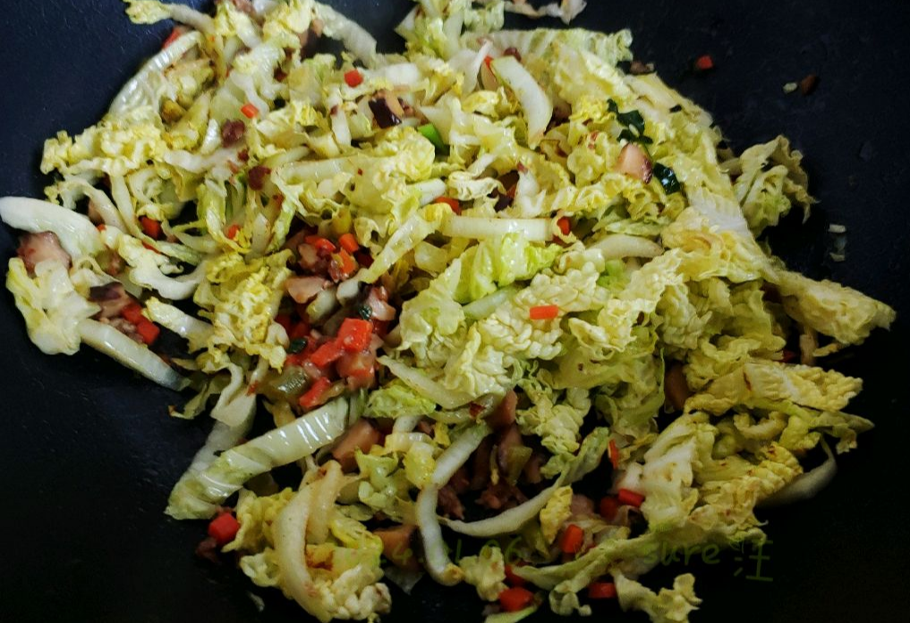 Stir-fry cabbage until tender for a delicious dish.