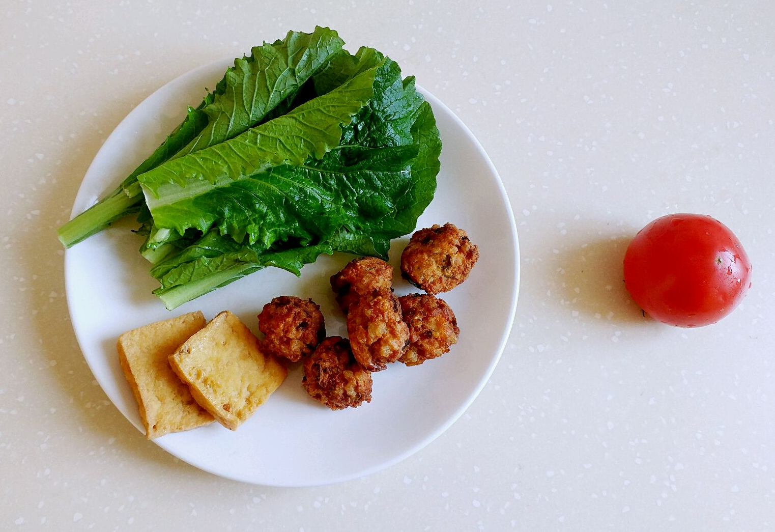 Wash and chop tomato, baby bok choy. Set aside tofu, veggie meatballs.