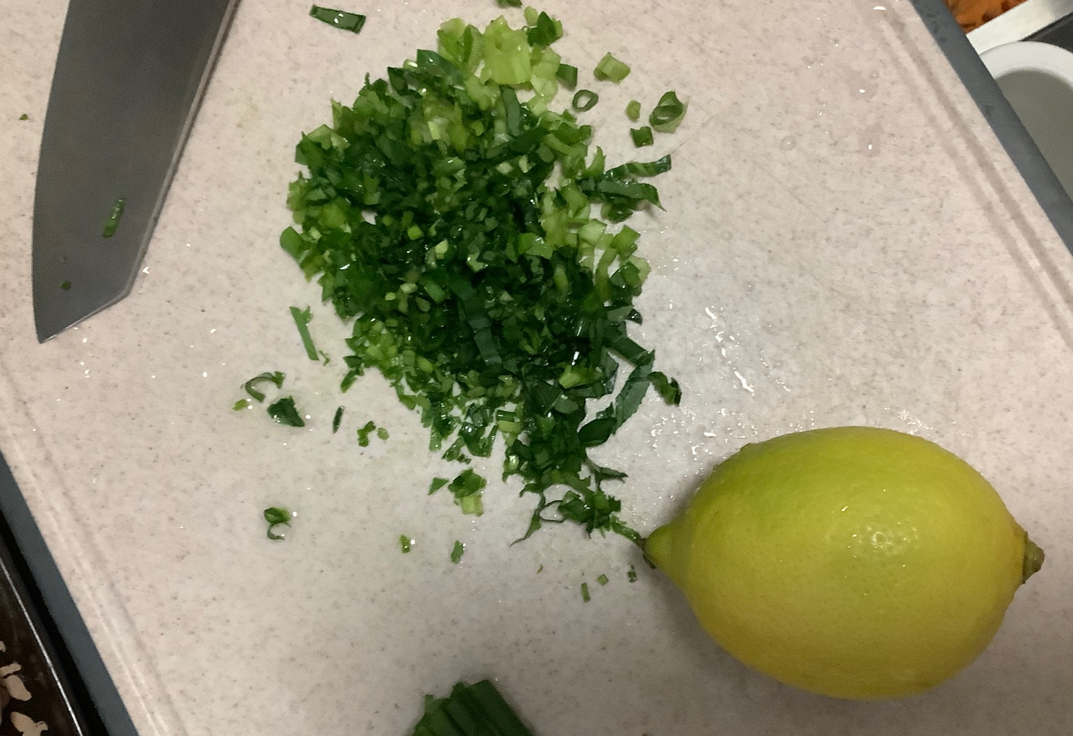 Prepare and wash celery, cilantro, leafy greens, and green onion, then finely chop.