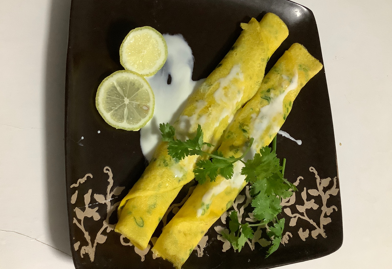 Roll omelette with set egg mixture on both sides. Make 2 if desired.