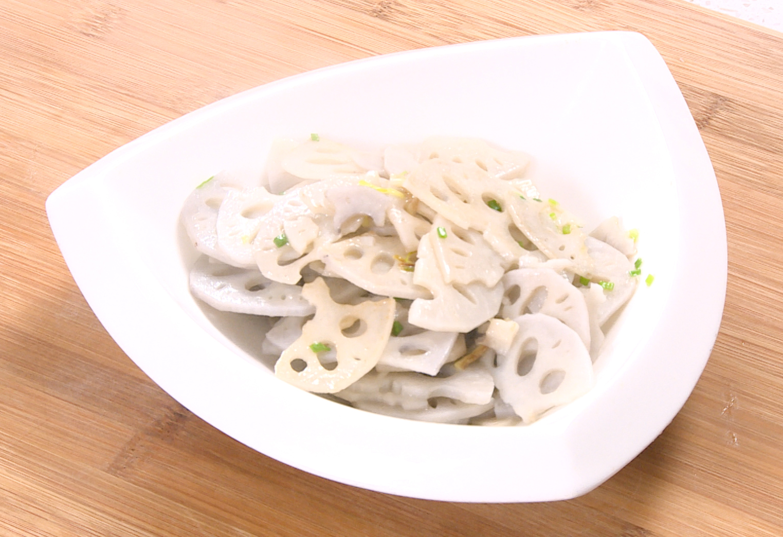 Finish by sprinkling green onion tops on the dish, stir, then serve hot.