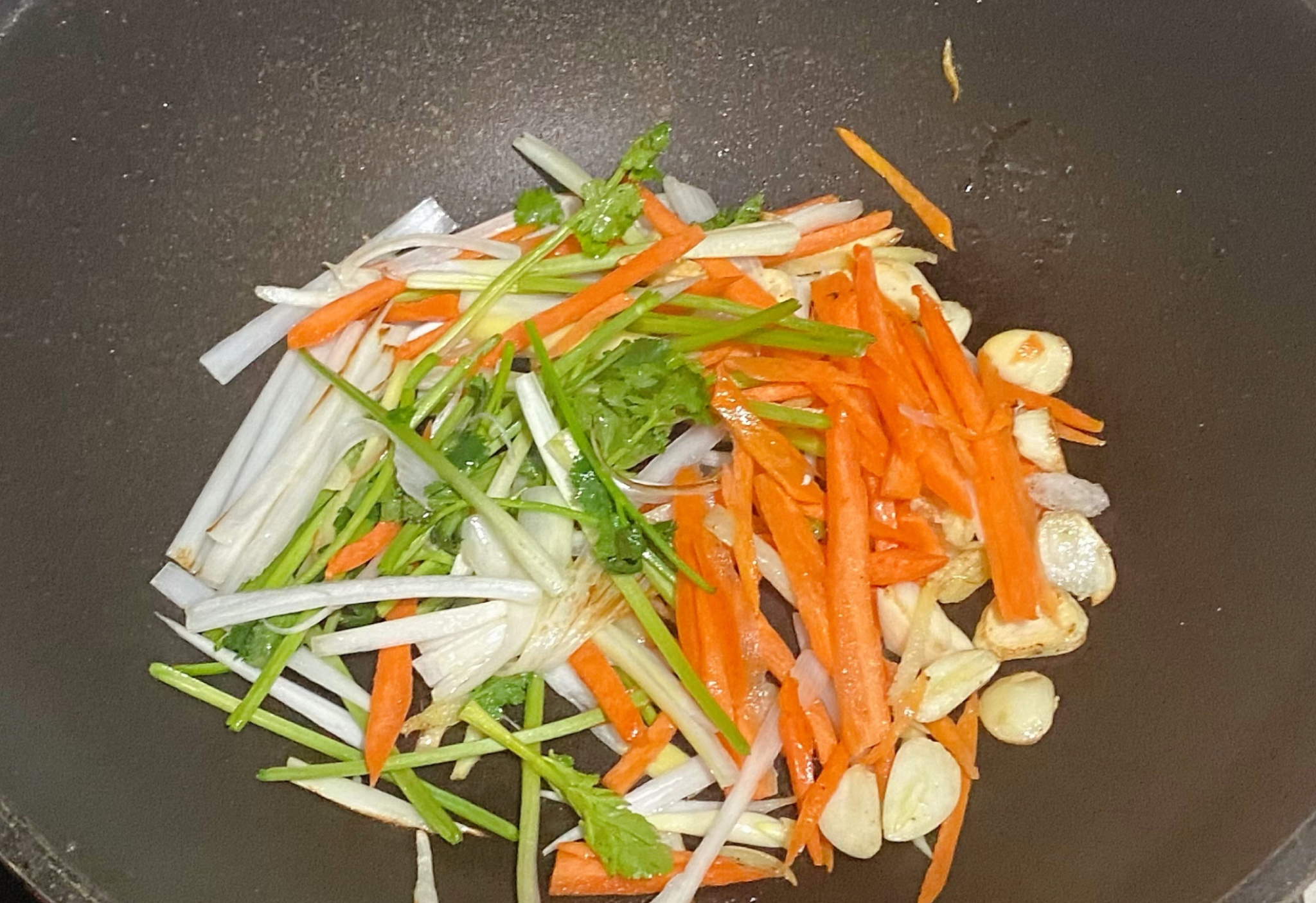 Combine carrot and cilantro, stir-fry until well mixed.