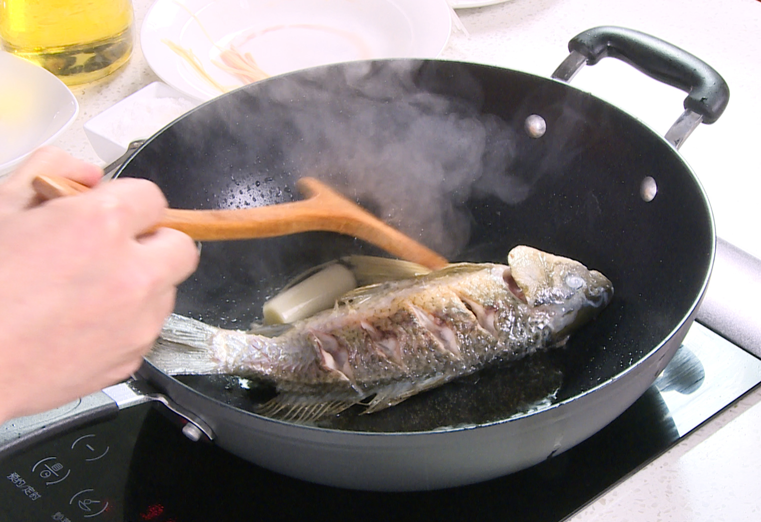 Add aromatics like ginger and leeks to the pan and cook until fragrant.