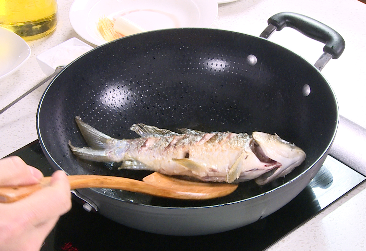 Fry fish in hot oil until golden brown on both sides.