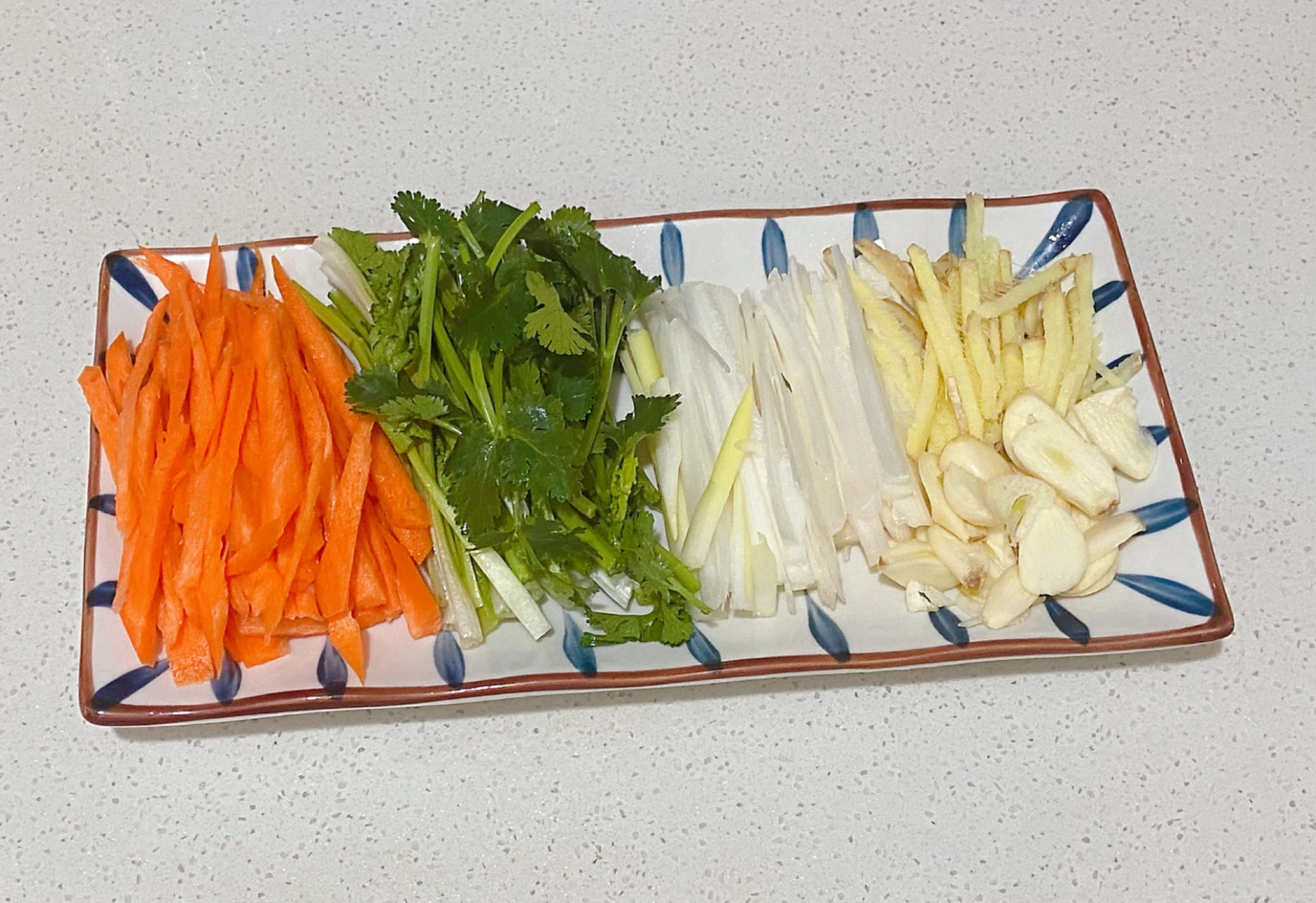 Prepare ingredients: Slice carrot, cilantro, ginger, and garlic into strips.