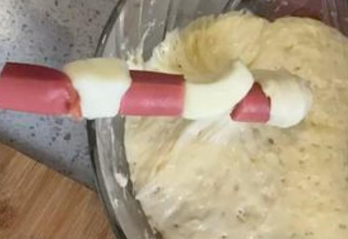 Ensure even coating by making sure the batter evenly covers hot dogs. Add water to thin batter if needed.