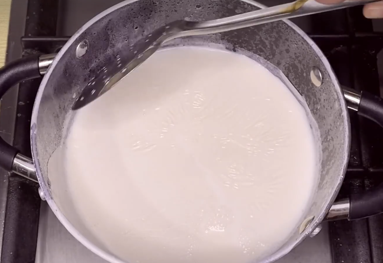 Boil whole milk, then skim off cream layer.