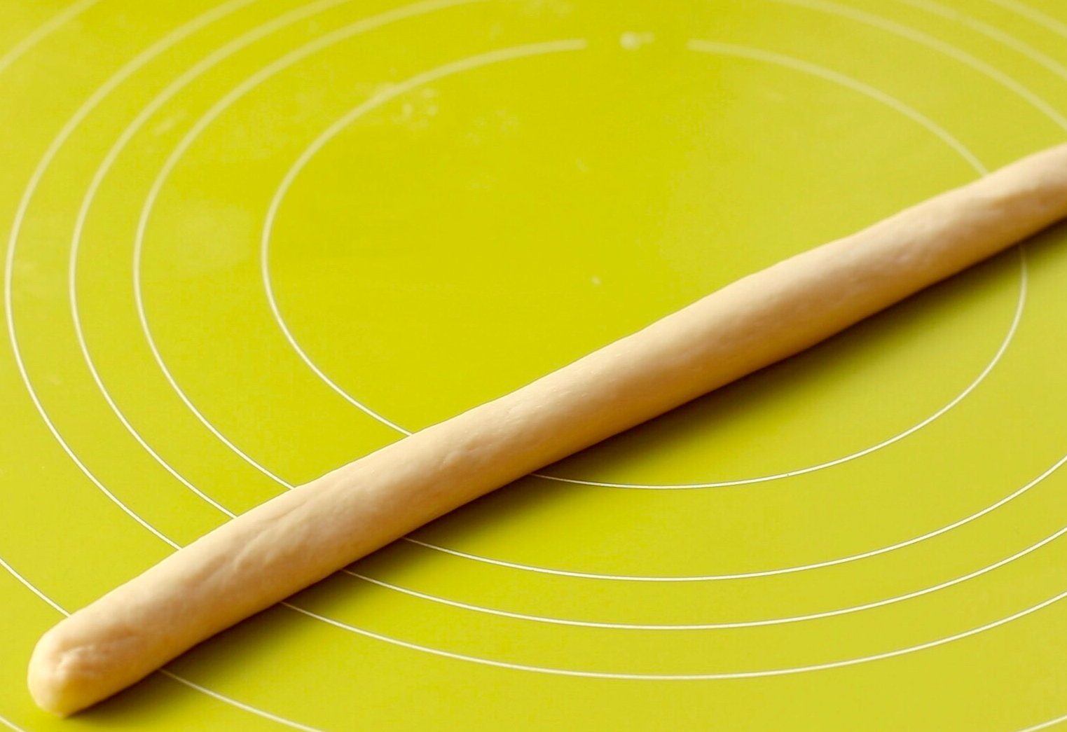 Shape dough into long with thicker end; to bake for specific recipes.