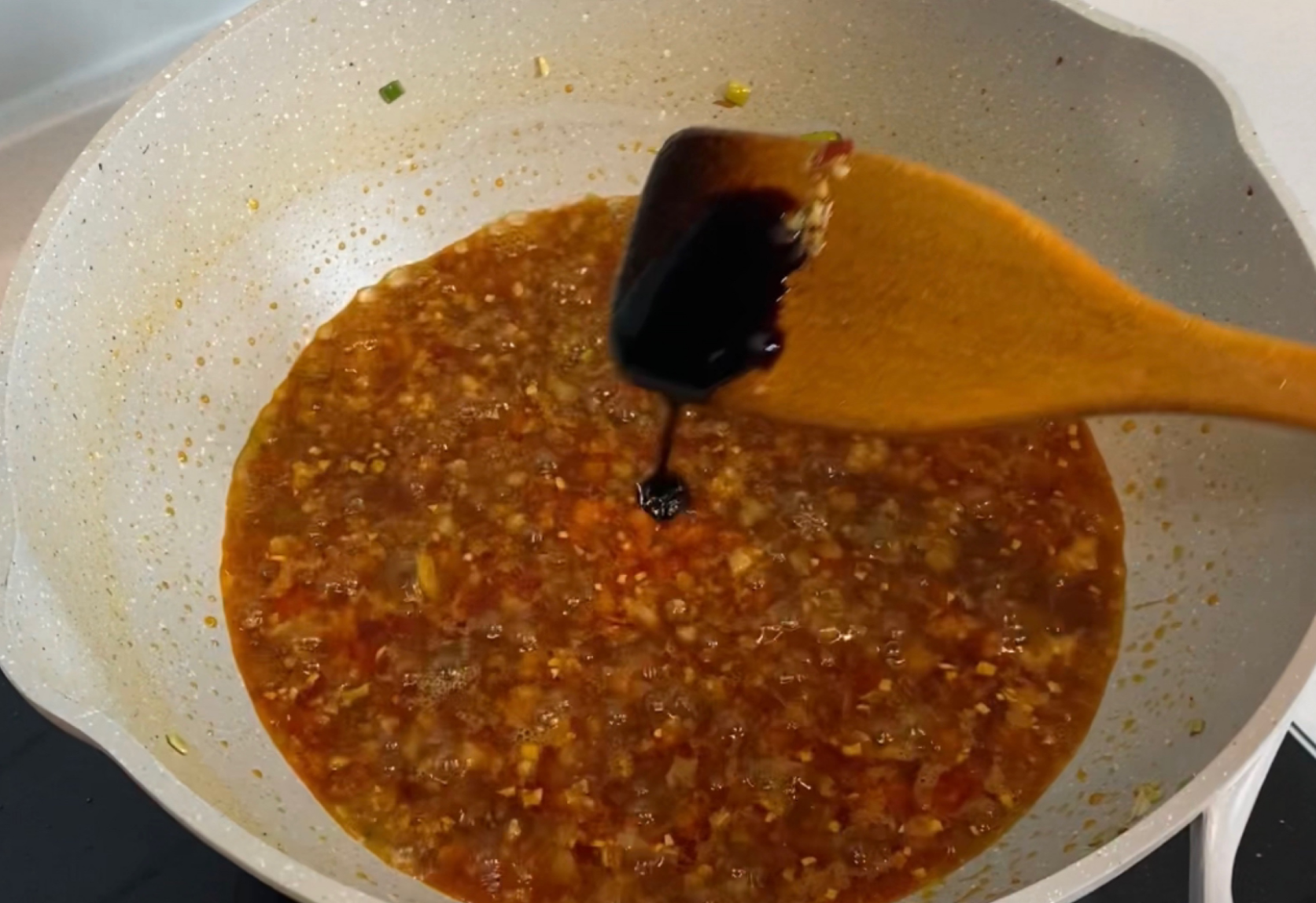 Add dark soy sauce for enhanced color in the sauce.