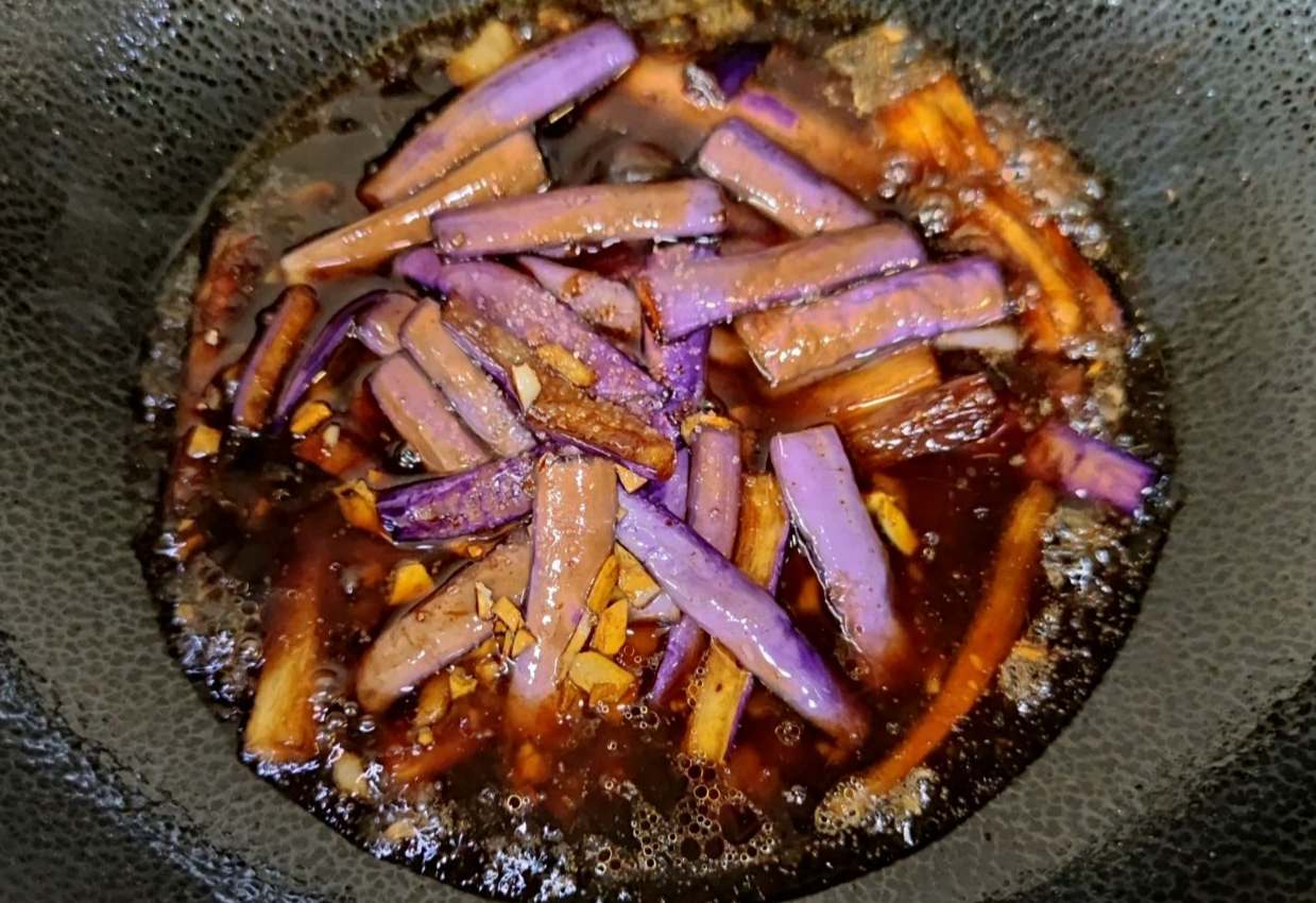 Boil eggplant in water until absorbed flavors.