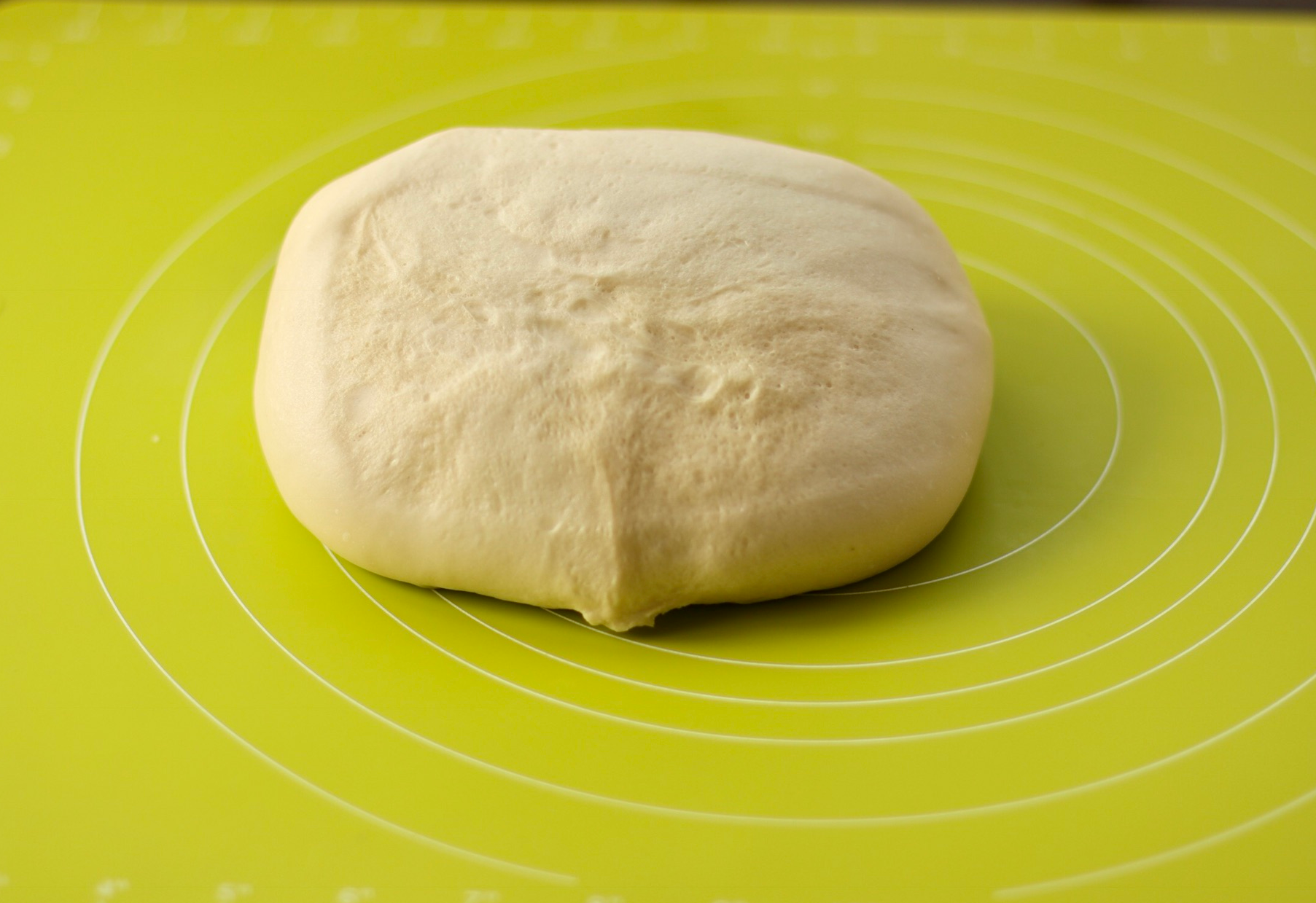 Instruction to transfer dough onto a work surface.