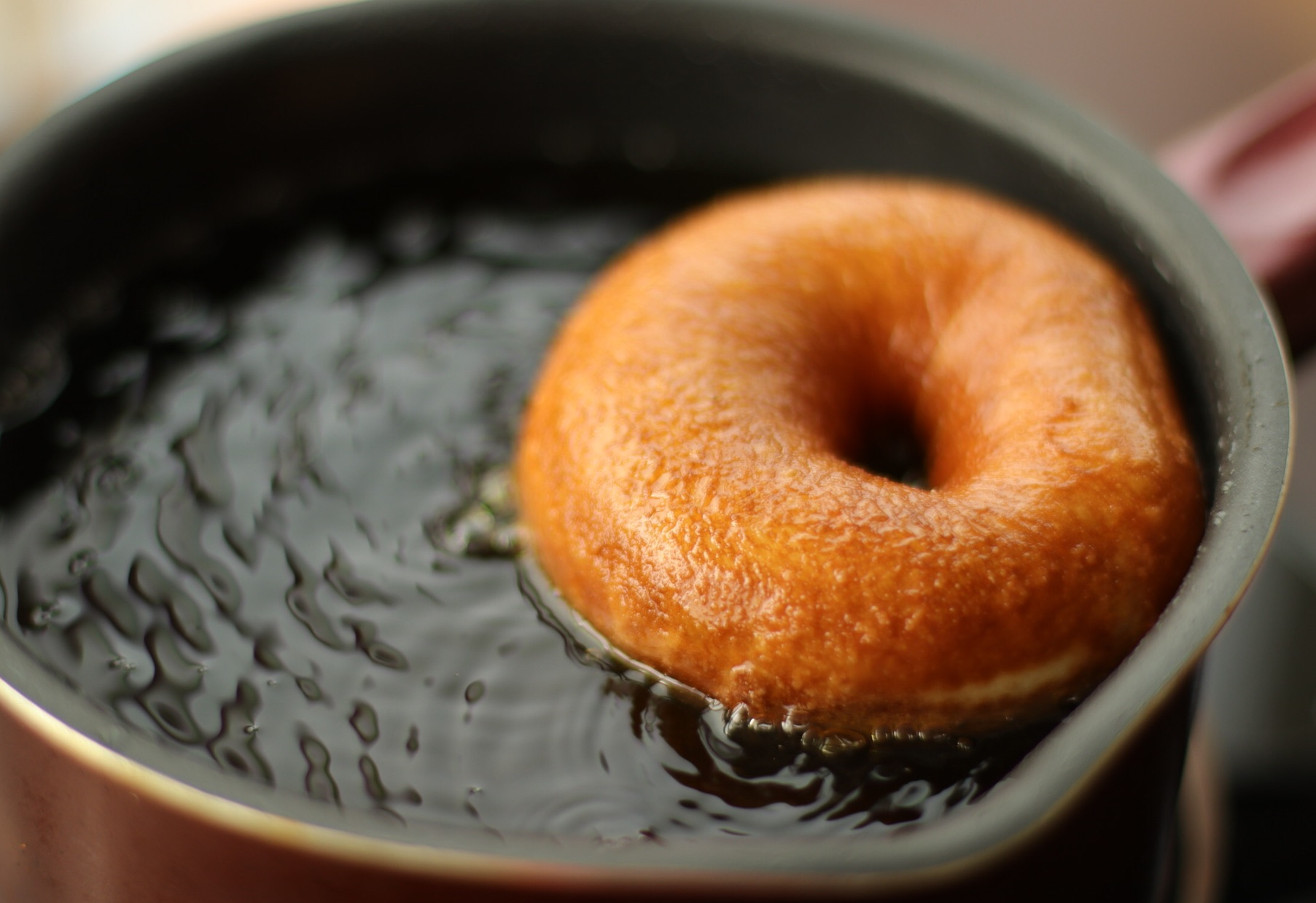 Fry donuts in hot oil until golden brown on each side.