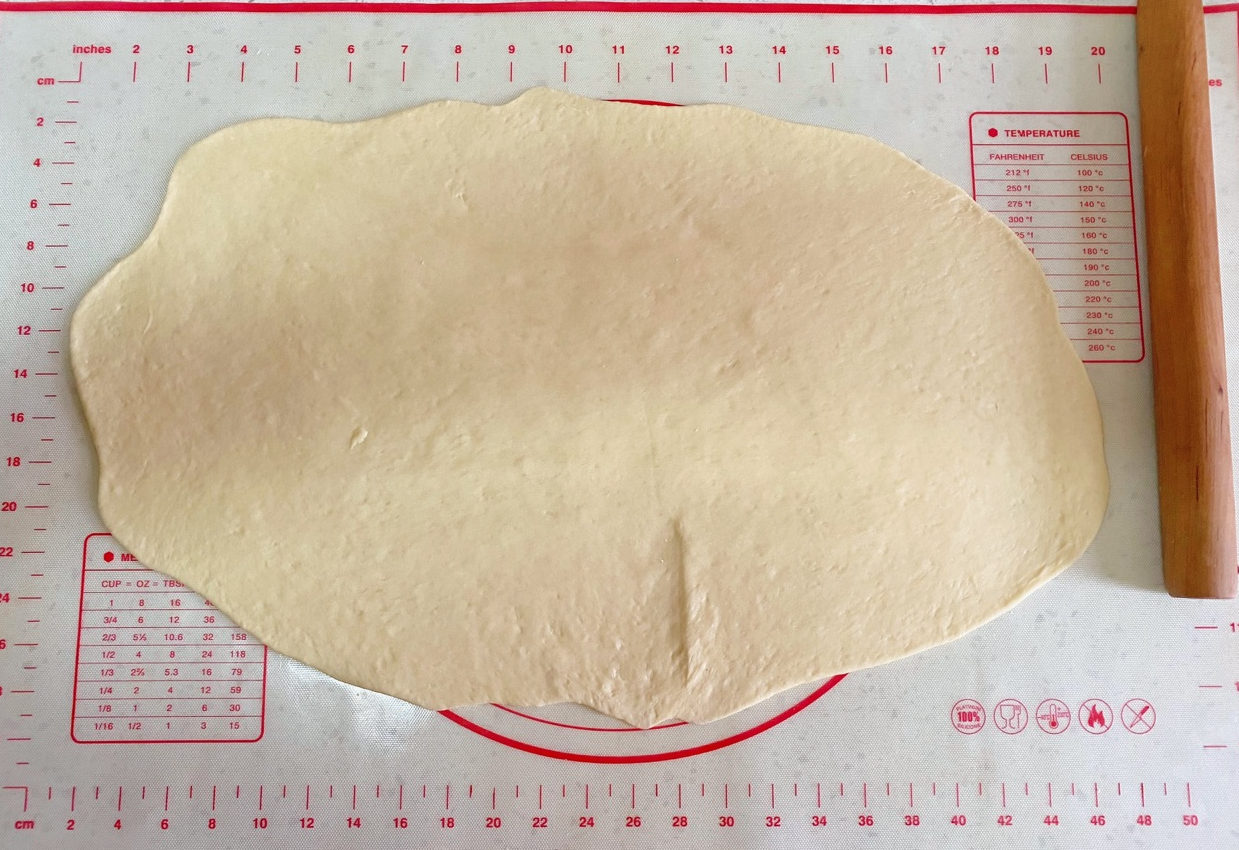 Roll out dough to 1 cm thickness without deflating.