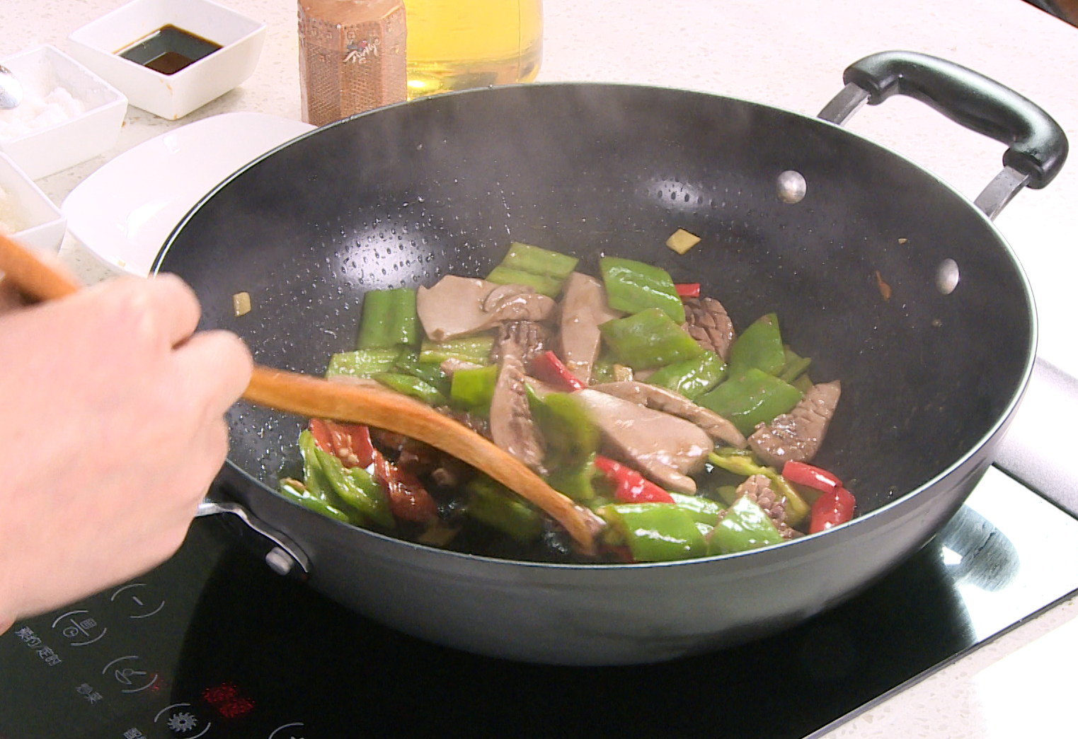 Thicken sauce with white pepper and cornstarch mixture in a skillet.