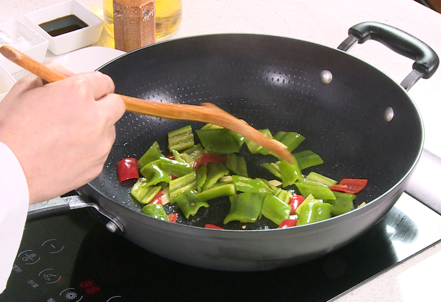 Stir-fry ginger, bell peppers in hot oil for fragrant, flavorful dish.